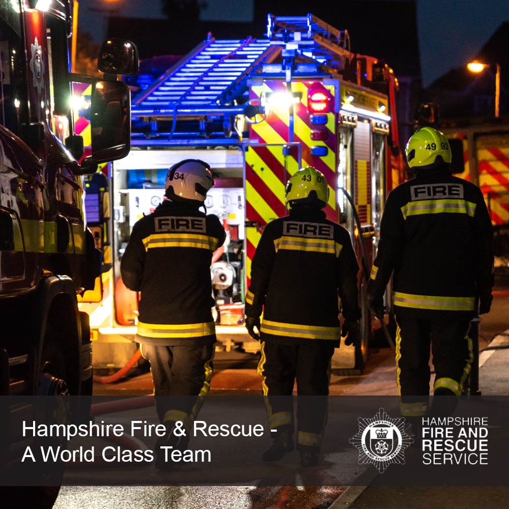 Team of fire fighters in a street scene