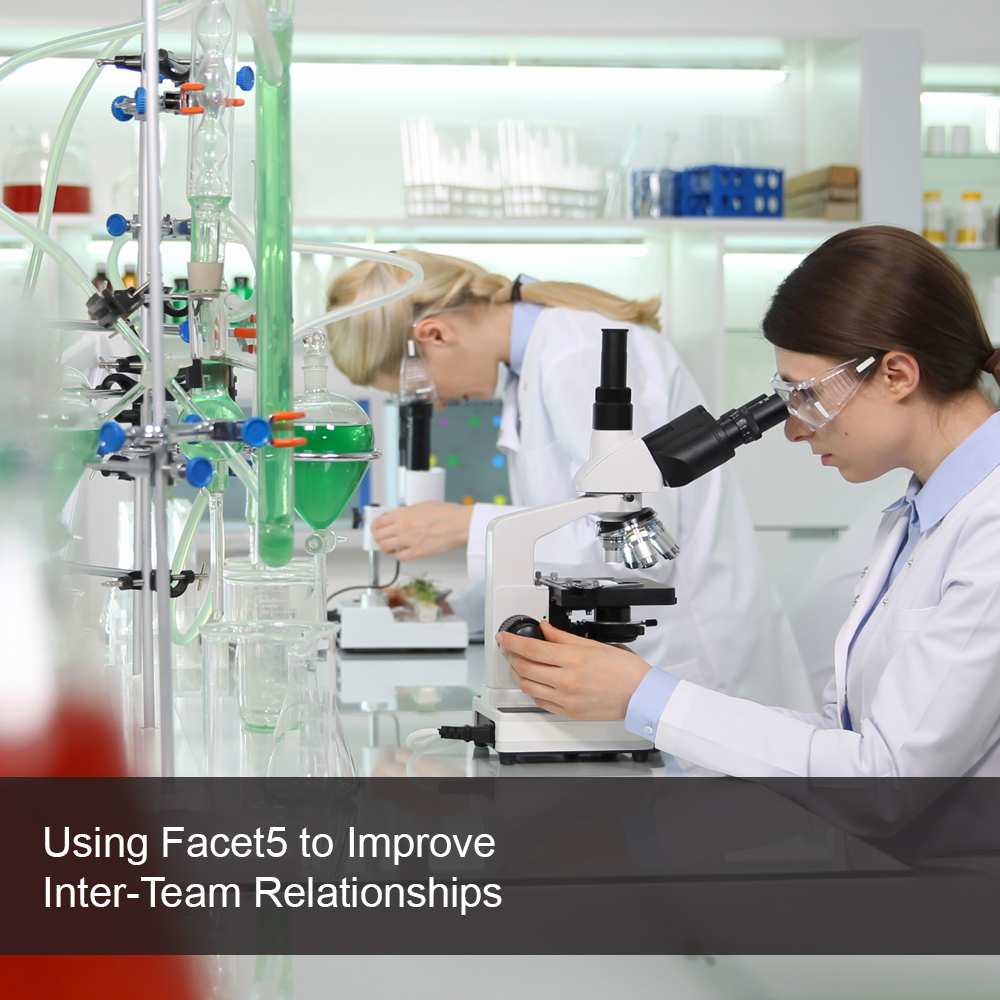 Team members working together in a science lab.